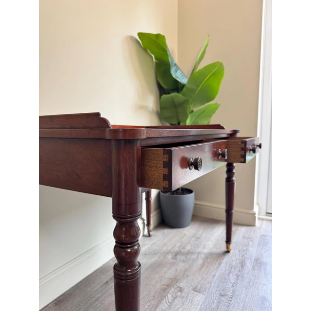 Solid wooden antique vanity unit with three hand cut dovetail drawers all run smooth. This is an antique piece but is in...