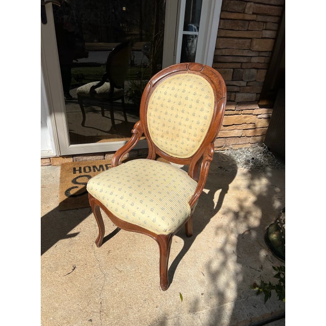 Upper consideration is a beautiful antique wooden chair with yellow cushions on the back and seat area. This would look...