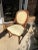 Upper consideration is a beautiful antique wooden chair with yellow cushions on the back and seat area. This would look...