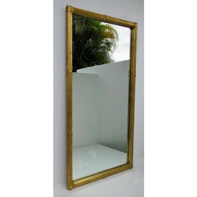 Vintage: C.1950's; Hollywood Regency era, Italian Wood-carved, gilded gold Pier or Wall Mirror. Some details that abound...