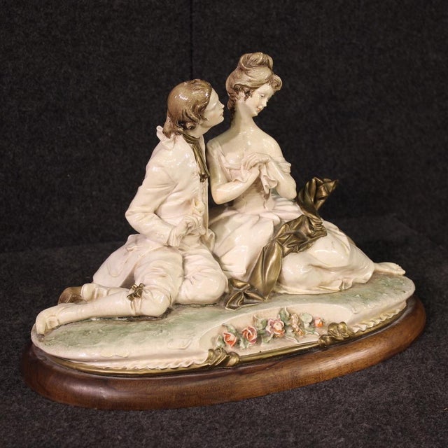 Italian sculpture dated 1981. Capodimonte ceramic artwork signed B. Merli depicting a romantic subject, a couple of...