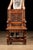 An elaborately carved Gothic Revival wainscot armchair dating approximately to the late 19th century. The chair combines...