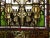 Antique late 19th century hand painted and stained glass double hung window having castle vignette with ornate finial...