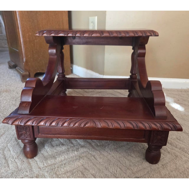 Late 20th century mahogany bed steps. Two risers with supports and carved accents. Perfect bedside accessory.