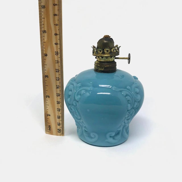 This antique EAPG blue glass oil lamp is in good condition as pictured with no chips or cracks.