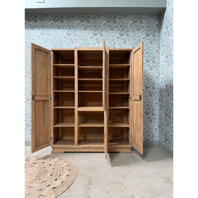 This large, characterful wardrobe, carefully restored, embodies the understated, geometric elegance of french furniture...