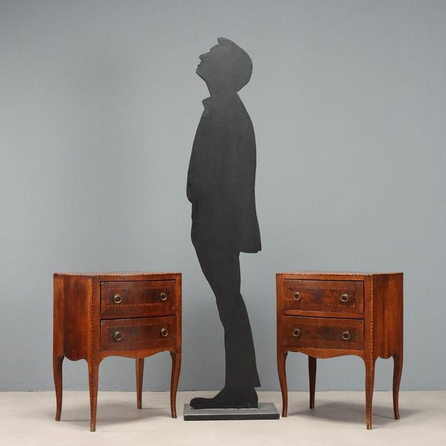 Pair of Barocchetto style nightstands, crafted in walnut with elegant alternating maple and walnut inlays, typical of...