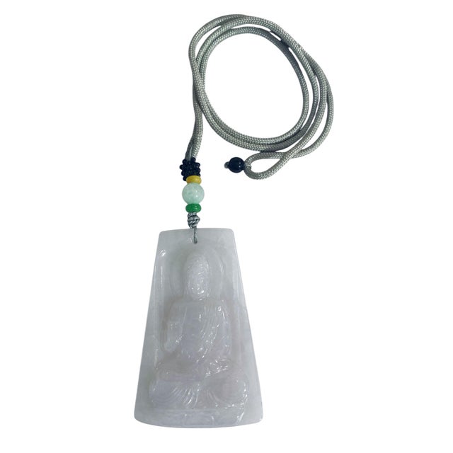 Handcrafted from jadeite jade, this intricately designed pendant showcases the legendary Lord Buddha in exquisite detail....