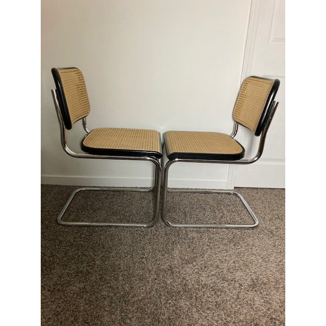 Pair of Thonet Classic Breuer Side Chairs purchased new in 1988. Natural cane with the original 410 black enamel finished...