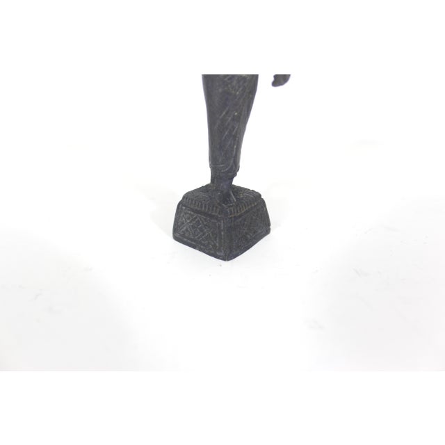Vintage cast bronze Southeast Asian female figurine with a dark patina. A great addition to your shelf styling. 1.5” wide...