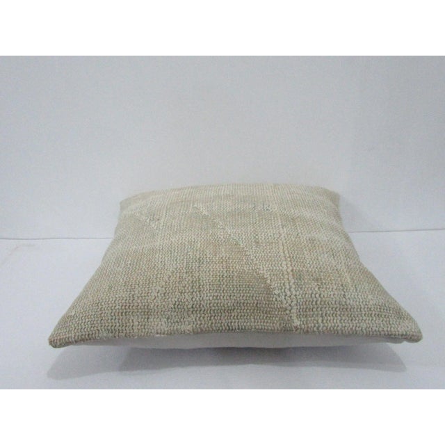 Decorative pillow cover made from a vintage Turkish handknotted rug. Backed with good quality cotton fabric. Pillow...