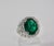 Contemporary Oval Emerald 12.25 Carat Diamond Surround Ring Size 8 For Sale - Image 3 of 9