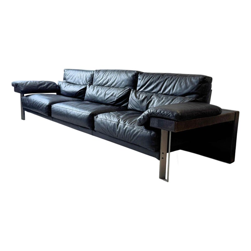 Black leather sofa with metal legs