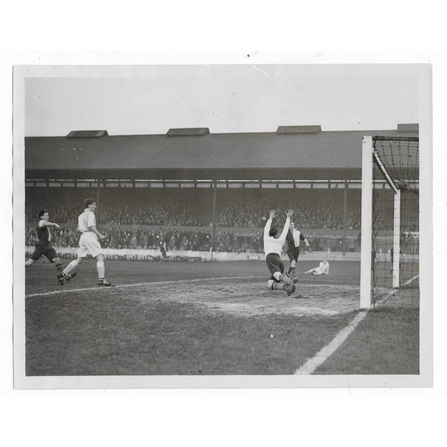 1931 black and white photo of Oxford University versus Cambridge University at Stamford Bridge in London. Publication...