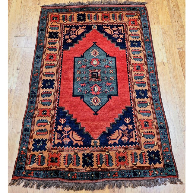 This beautiful vintage Kurdish tribal rug is a compelling example of traditional handwoven artistry at its most expressive...