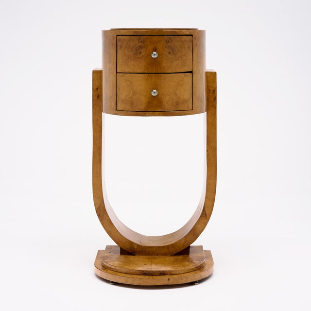 A charming French Art Deco side table; circa 1930, beautifully crafted in richly figured burled ash with warm golden...