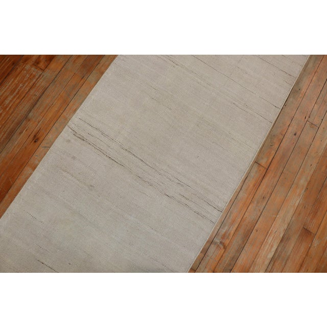 A midcentury handmade Moroccan flat-weave runner with a modern twist, circa 1950. Measures: 2'3" x 7'7".