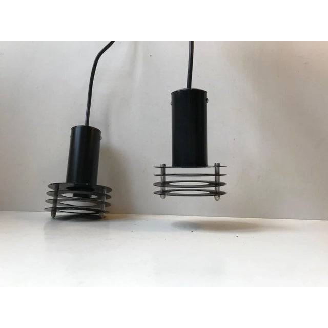 Black 3-tiered small metal hanging lamps from Danish Lyfa. Designed and manufactured during the 1970s. E27 up to 40 watts...