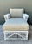 This vintage rattan lounge chair and ottoman, crafted in the style of Bielecky Brothers, embodies the relaxed...