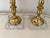 Brilliant pair of vintage cranberry blown glass lamps with ornate brass columns and mounted on marble bases. Circa 1960s....