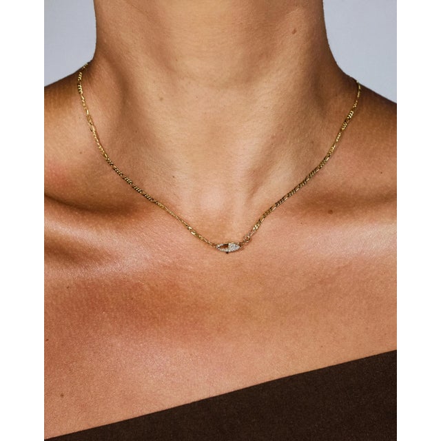 This is part of Chairish’s Fine Jewelry assortment. A timeless design with a refined edge, this solid 14k gold figaro...