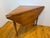 A triangular napkin dropleaf table made of solid Cherry. This piece has a unique form and drop-leaf design that allows for...