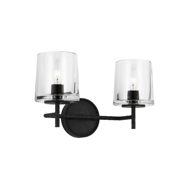 The Marietta two light vanity fixture in Aged Iron embodies Industrial charm with Midcentury flair, the Marietta vanity...