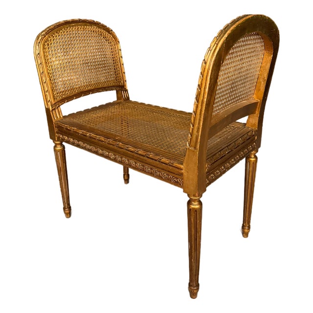 19th Century French Louis XVI Style Gilded Bench With Cane Seat and Side Armrests, Circa 1890 For Sale
