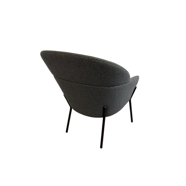 Italian Lounge Chair Wam 1570 designed by Marco Zito for the Italian brand Bross. It features an enveloping, curvilinear...