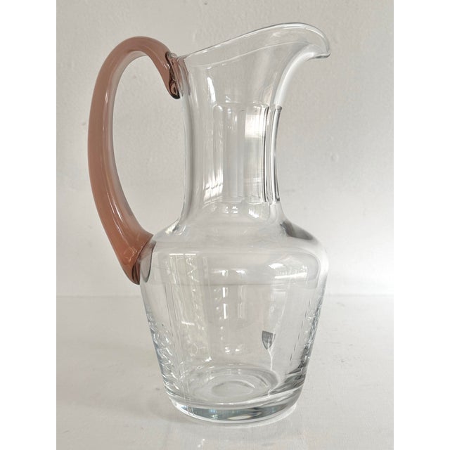 Orrefors Sweden vintage glass pitcher with pink handle. Designed for enjoyment and excellent for daily use. Circa 1970s....