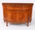 This is a superb antique Sheraton Revival demi-lune satin wood and marquetry cabinet, Circa 1900 in date. The cabinet is...