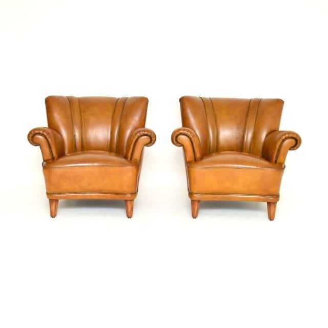 A superb pair of vintage Swedish leather club armchairs. They were recently imported from Sweden, they date from around...