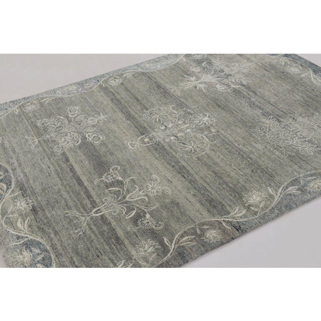 Hand-knotted in a luxurious blend of wool and silk, this 5x6 rug is a serene and sophisticated addition to the Block Print...