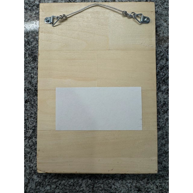 Mid-century whimsy on solid wood board. A pop of red.