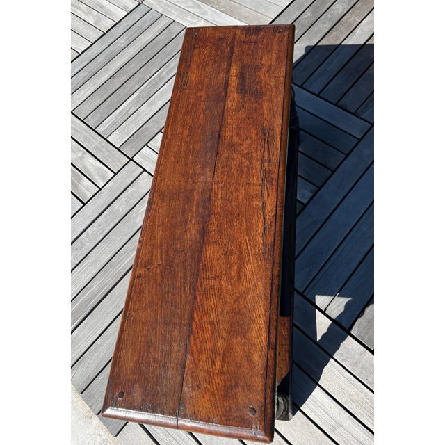 Oak bench probably made in the 19th century in the style of mid 17th century English brown oak Nicely worn top with carved...