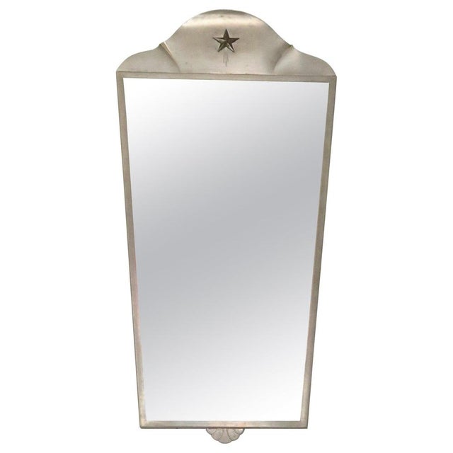 Iconic Swedish Grace wall mirror in pewter with star decor in brass. Manufactured by GAB/ Guldsmedsaktieboaget, Sweden...