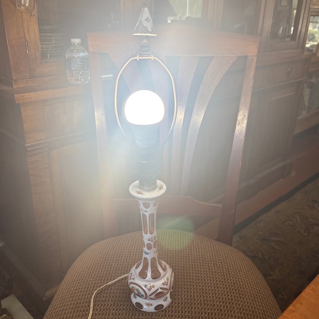 Beautiful Boudoir style lamp from Bohemia that has hand painted florals and pink glass inserts. This little lamp even has...