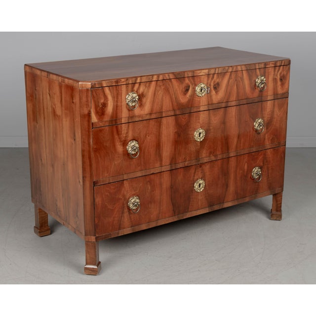 A fine 19th century Biedermeier commode from Austria made with beautifully patterned book matched veneer of walnut over...