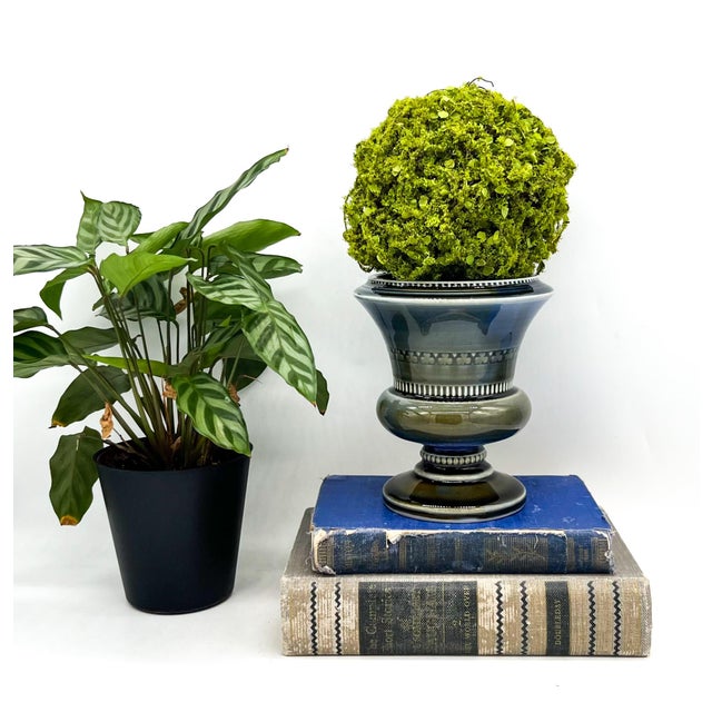 Elegant Wade Pottery porcelain pedestal vase featuring a vibrant blue interior and a softly graduated exterior with...