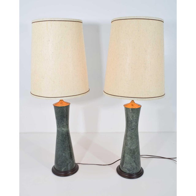 Elevate your living space with this beautiful heavy pair of marble table lamps in a teal color with brass trim. Crafted...