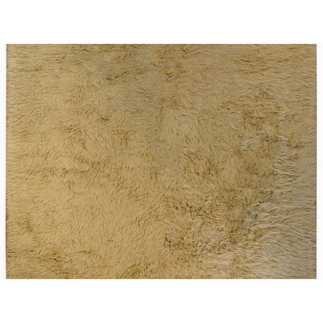 A wonderful vintage Grecian Flokati rug constructed with a beautiful camel colored shaggy wool.