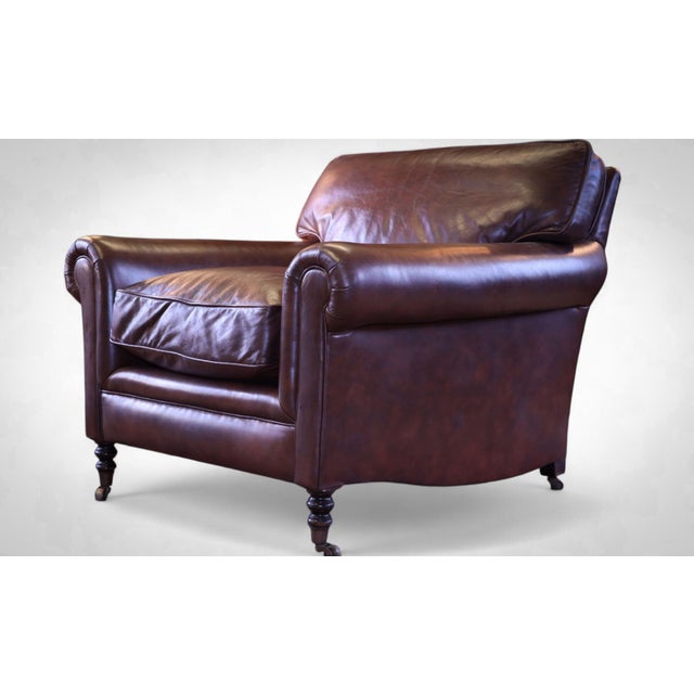 Up for grabs here is a stunning george smith full scroll arm signature armchair with cusion back in beautiful leather....