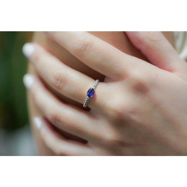Natural Blue Sapphire and Natural Diamond Stacking Ring, Set in 18K White Gold. Featuring a textured ribbed bezel set of...