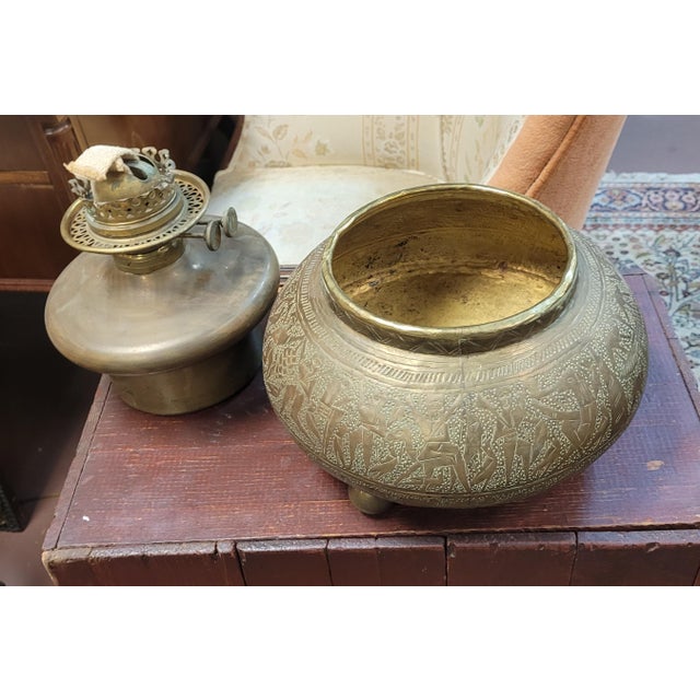 19th century antique R. Hollings & Co. oil lamp in the Arabian style. Features a hand done design all along the body of...