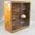 Vintage display cabinet with an Italian Art Deco design from the 1940s. Elm burl frame, rounded corners, and sliding glass...