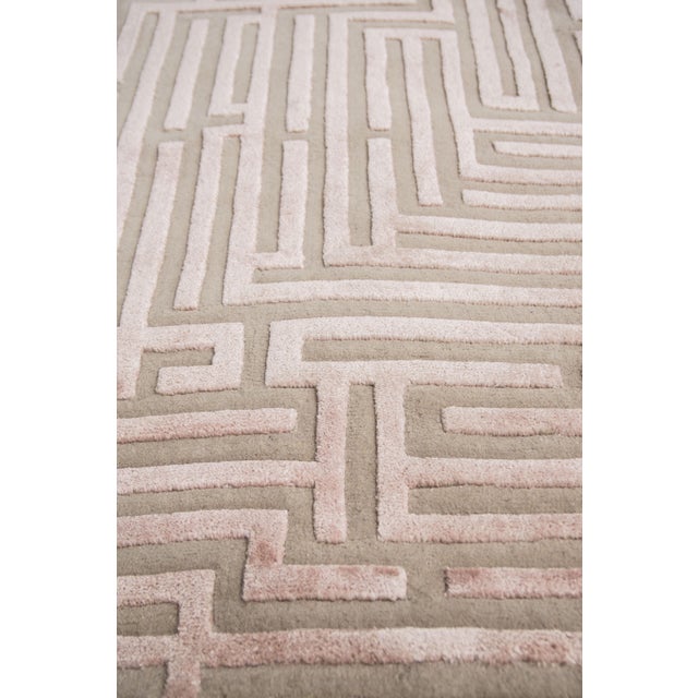 Walk the maze with the Anatolia geometric handmade rug design, named after the birthplace of the ancient word for...