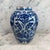 A beautiful late 18th century Dutch Delft blue and white baluster vase, hand-painted with a vibrant floral composition...
