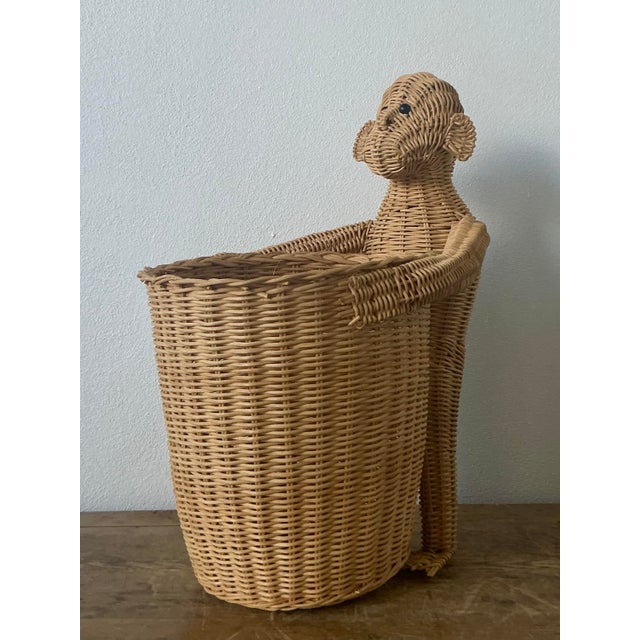 This delightful vintage woven rattan monkey basket is a charming example of the whimsical "Safari Chic" aesthetic that...