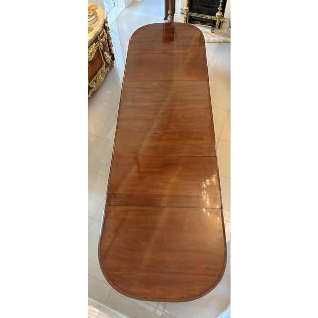 Outstanding quality antique regency 16 seater figured mahogany 3 pilar dining table having an outstanding quality figured...