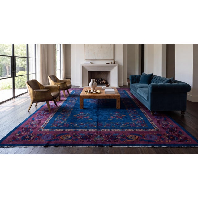 Hand-knotted with lush wool, this authentic Art Deco Chinese rug features an indigo-cobalt blue field framed by a rich...